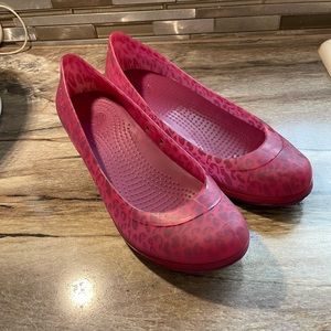 Woman’s pink Cheetah Wedge Crocs size 10